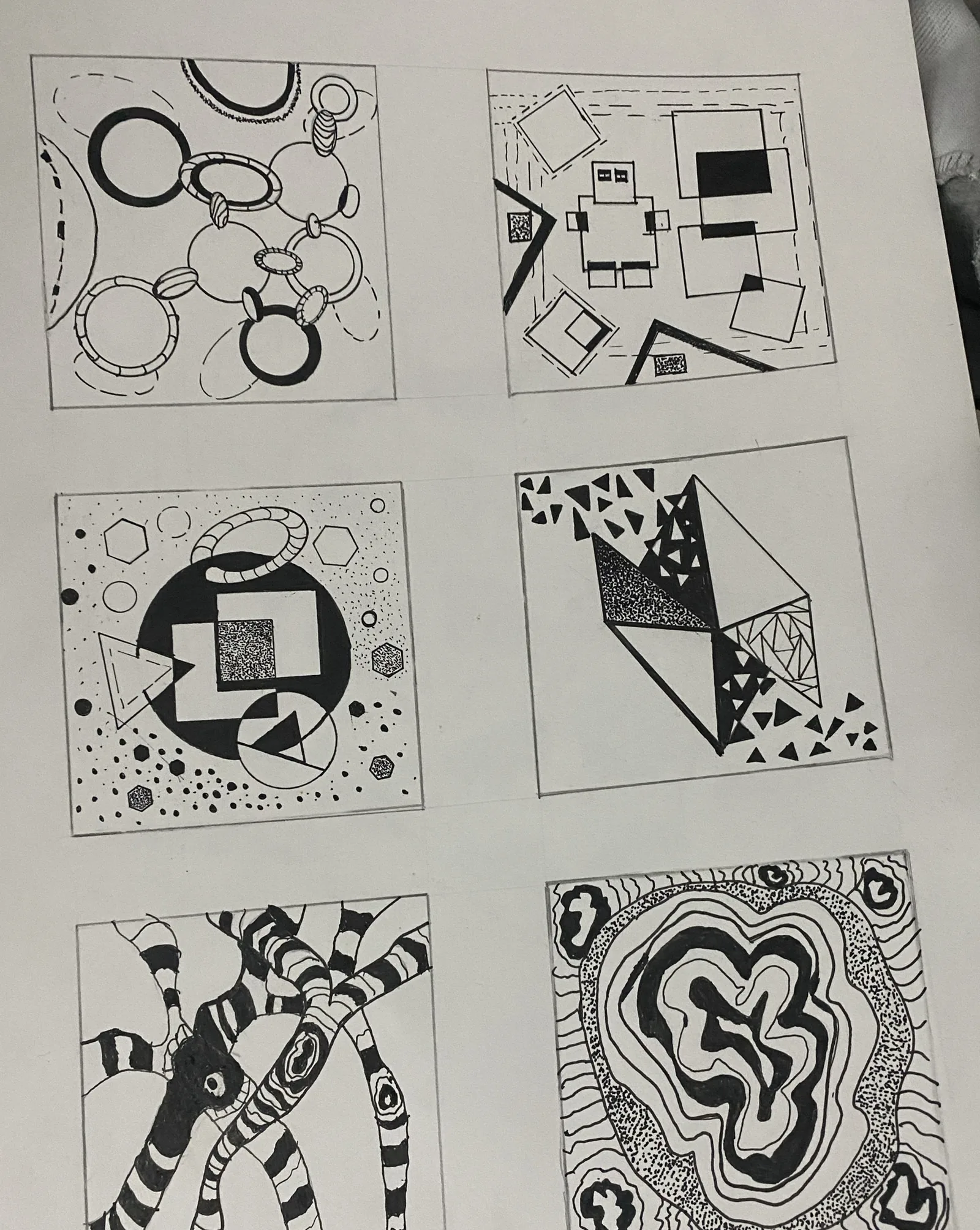 Six ink squares with circles, squares, triangles, stripes and organic shapes