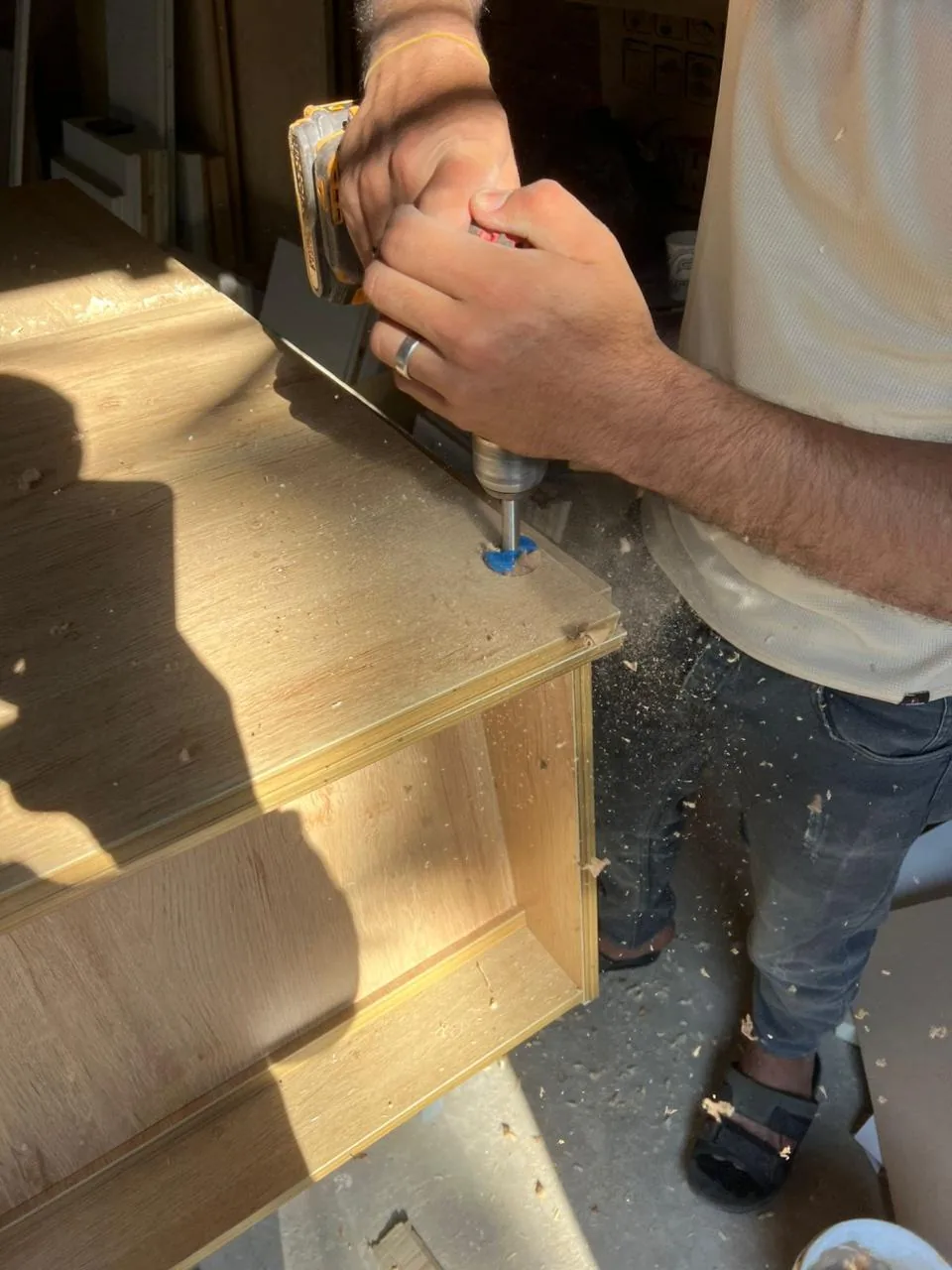 Drilling hinge holes into a wood-look panel