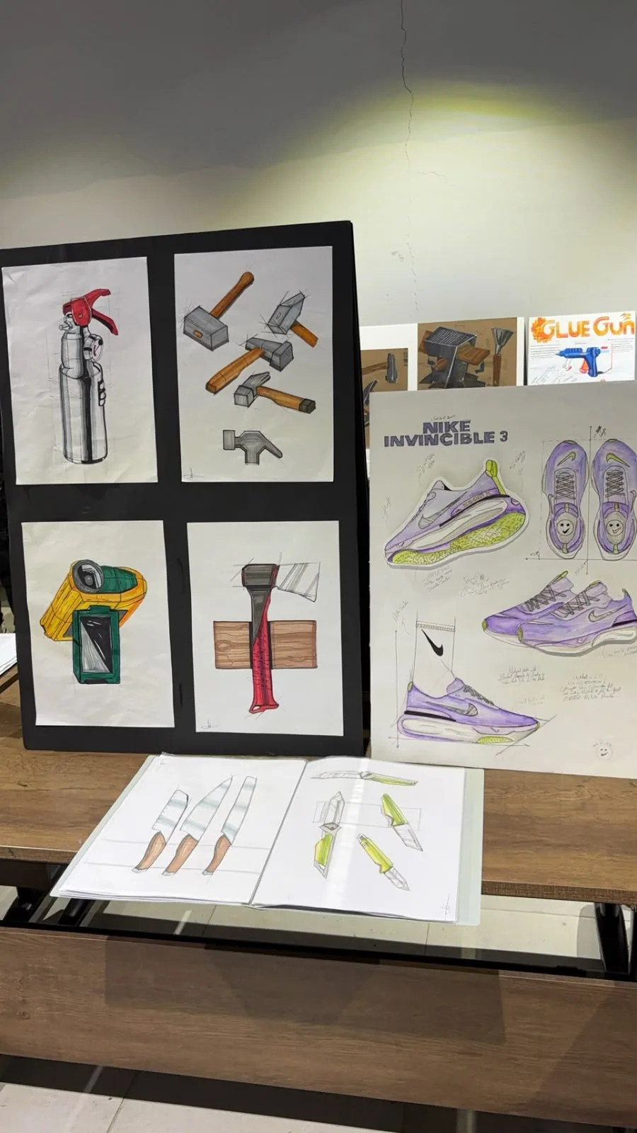 Jury display with sketches on a black board and the Nike board